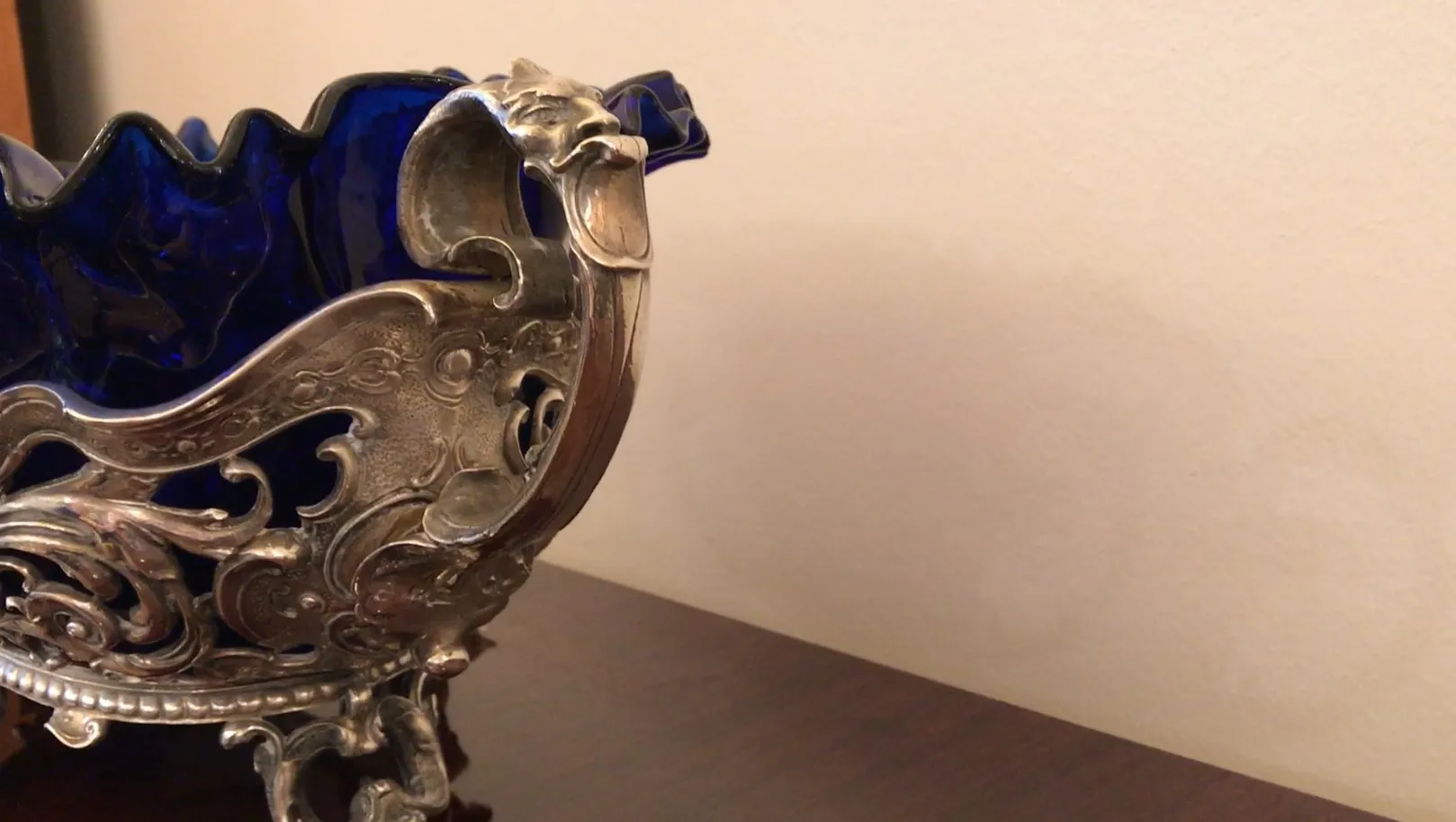 antique wmfs centerpiece with decorative design and blue