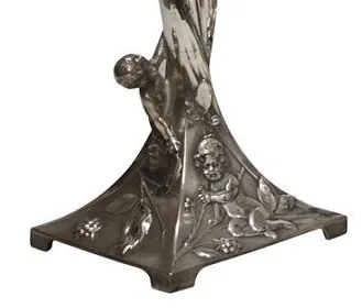Antique WMF centerpiece with carvings and decorative details.