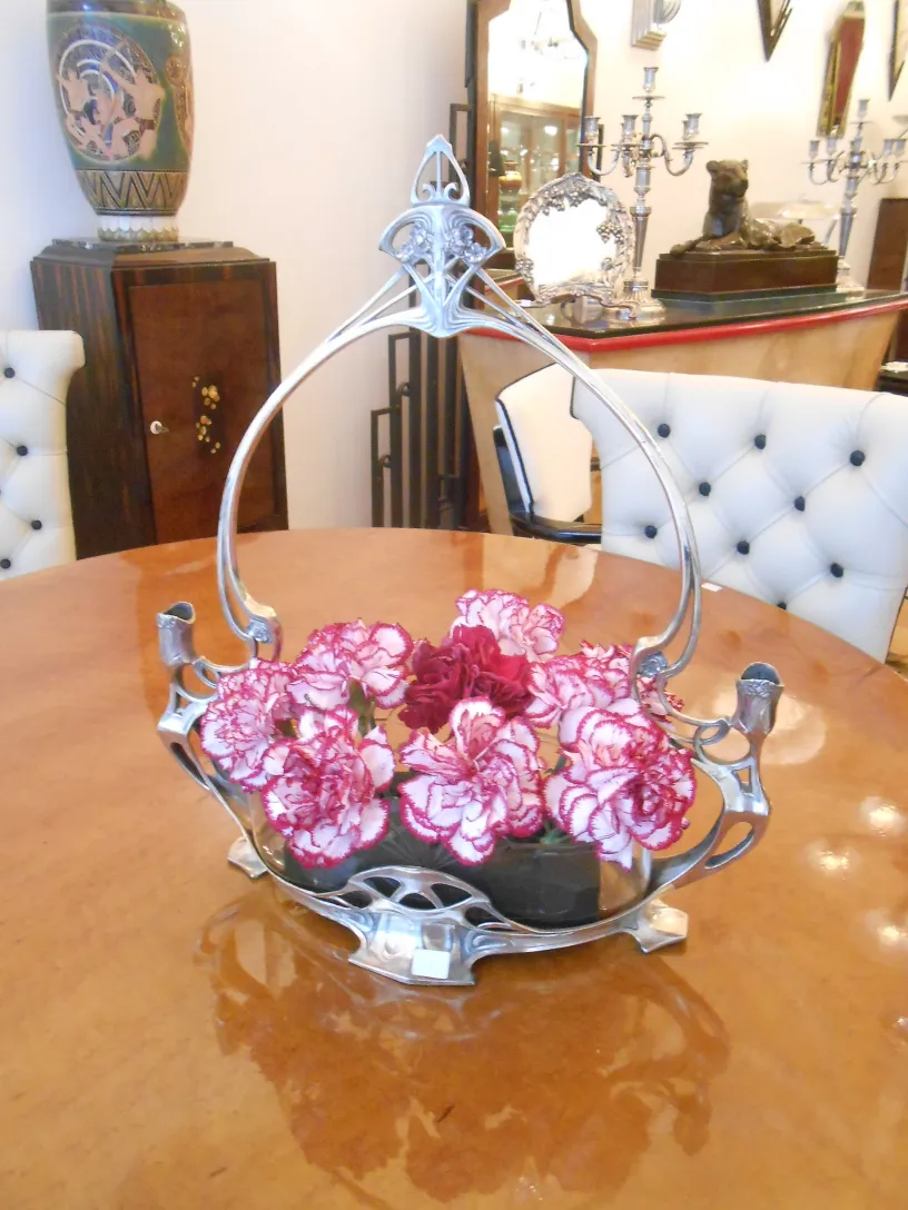 antique wmf centerpiece with flowers in an elegant setting