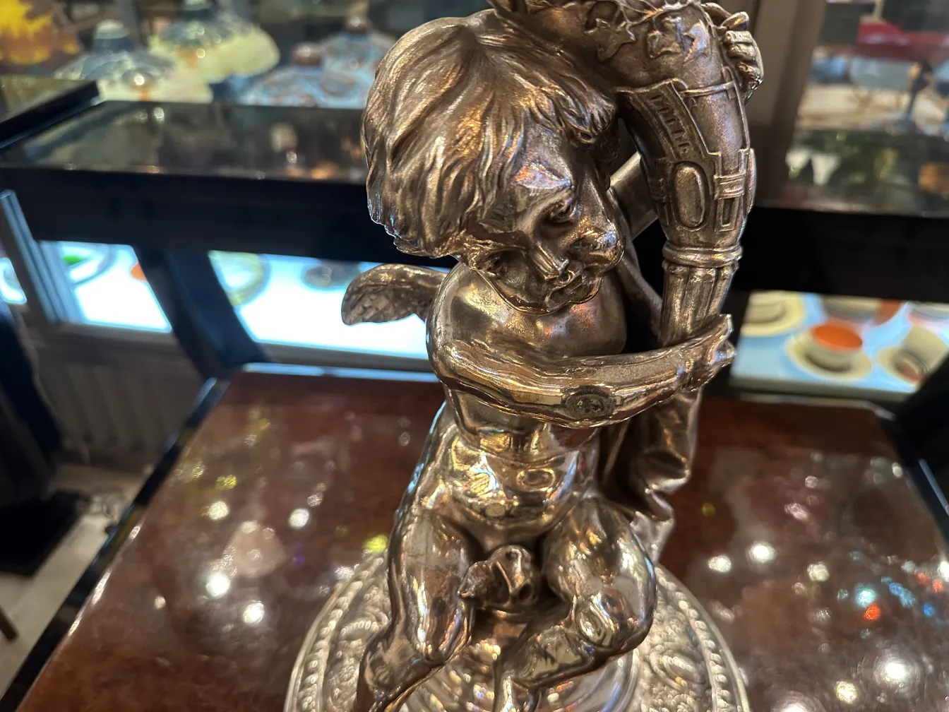 antique wmfs centerpiece with angel detail and ornate base