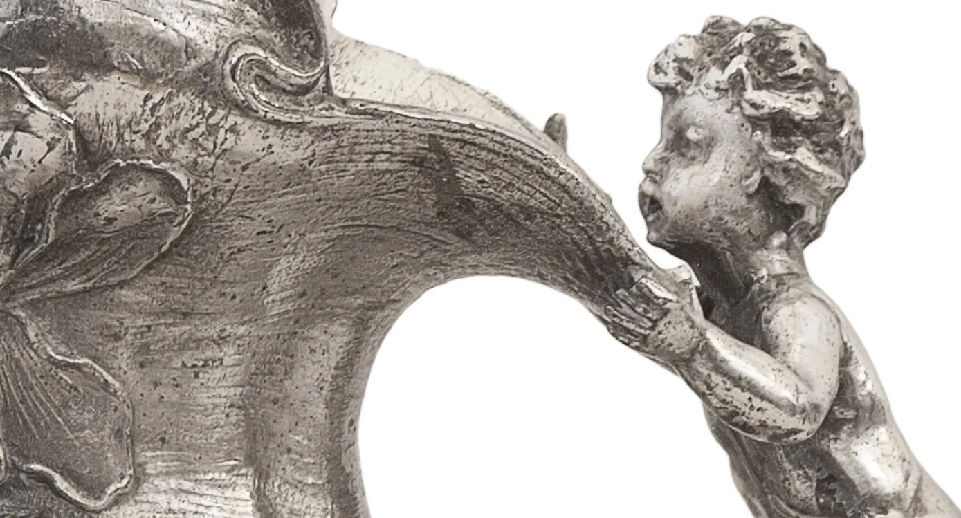 antique decorative jar with cherub holding it, relief details