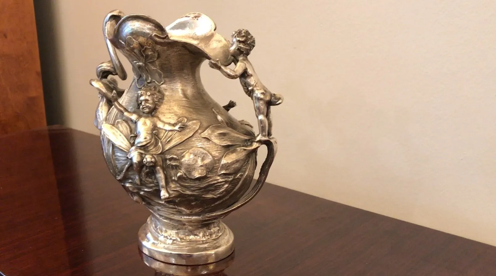 Antique jar with decorations of children, artistic style.