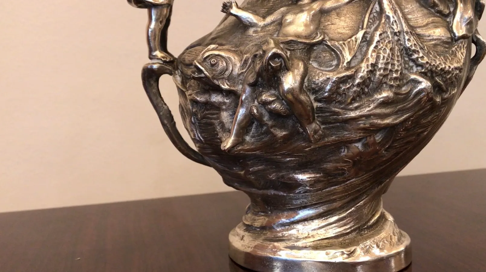 antique jar with sculptural details and artistic shape, in a simple setting