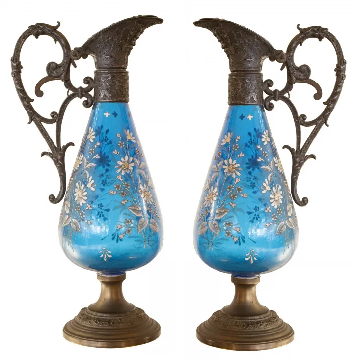 two antique wmf jars with floral design on blue background and metal details