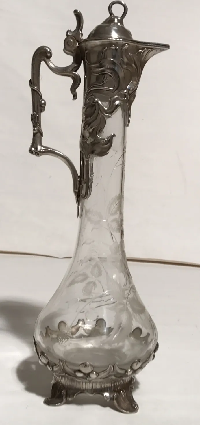 Set of 2 antique WMF jars featuring decorative design and unique elegance.