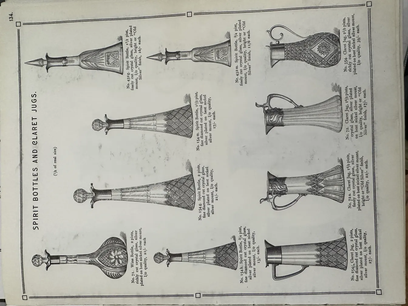 two antique WMF jars displayed on a page