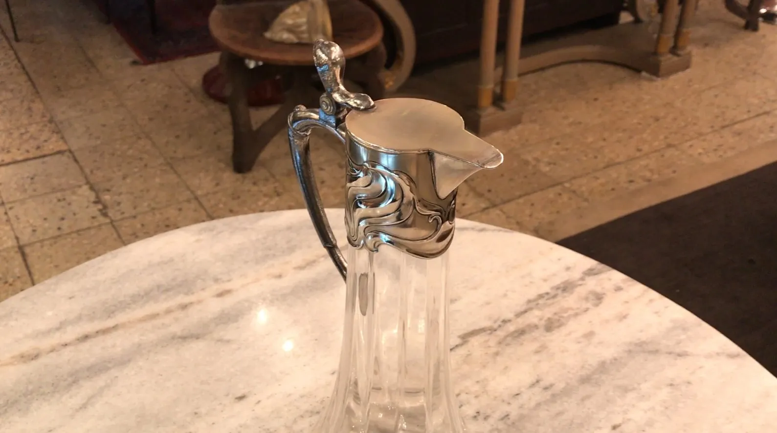 Two antique WMF jars on a marble table