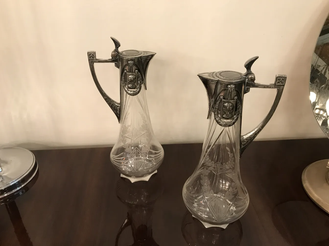 two antique wm-f jars with decorative lids, light background