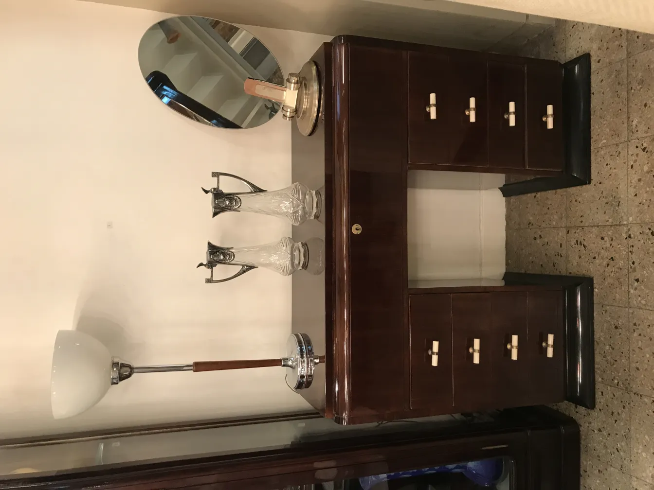 two antique decorative WMF jars, featuring unique designs, shown beside a lamp and a mirror