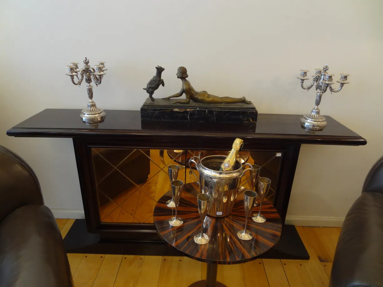 WMF champagne cooler on a table with candles and decor.