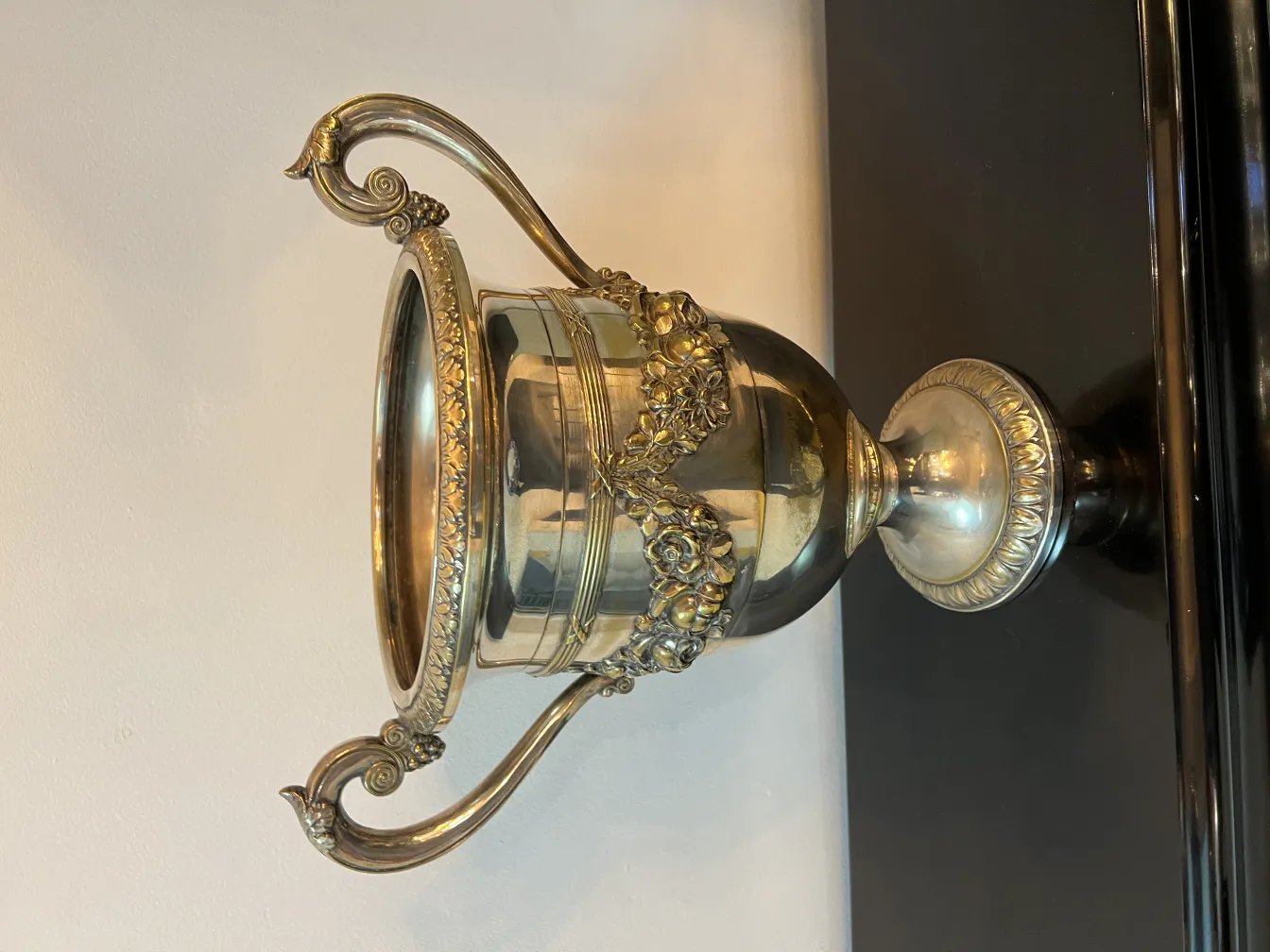 two antique champagne coolers with decorations.