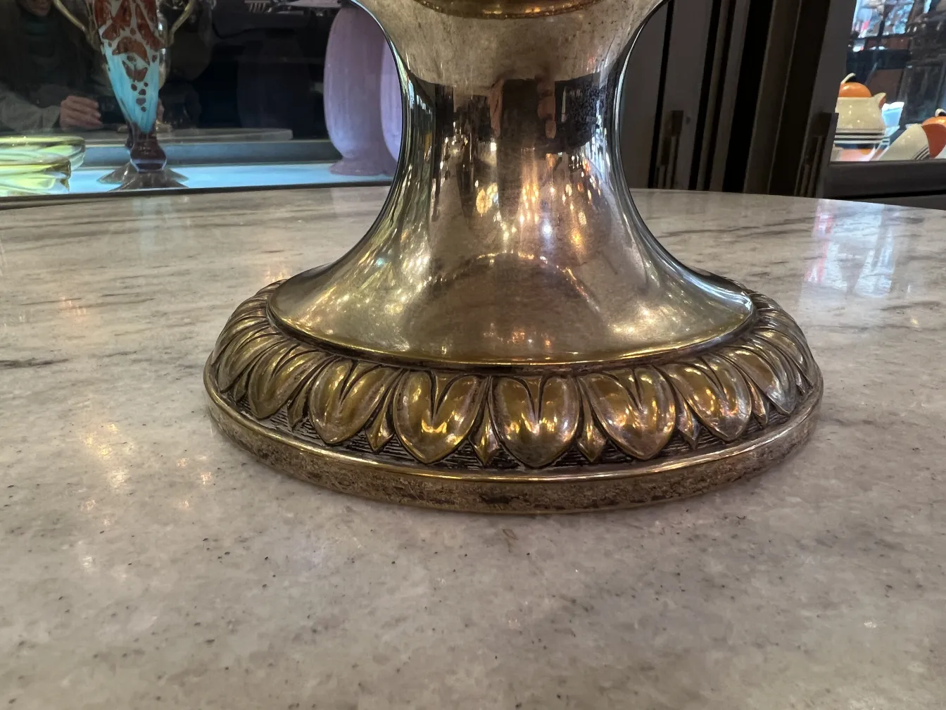 2 antique champagne coolers with decorative patterns on base