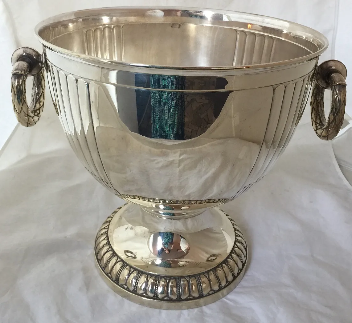 Two antique WMF champagne coolers with decorative handles.