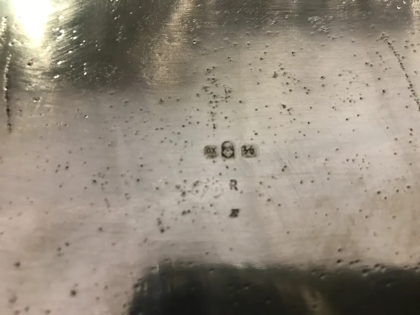 Plate of an antique WMF punch bowl with visible mark.