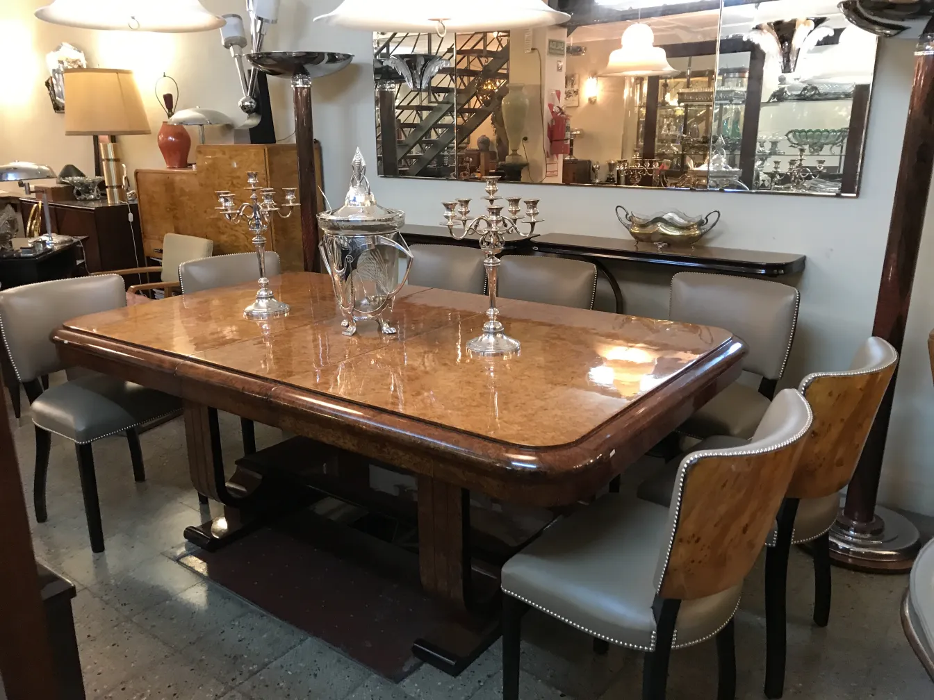 Antique punch bowl WMF on an elegant table, surrounded by candlesticks and vintage decorations.