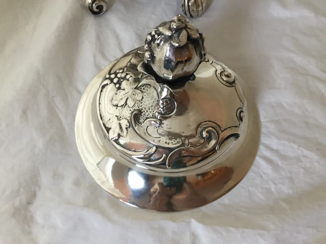 antique WMF punch bowl with decorative lid and shiny finish, elegant surroundings.