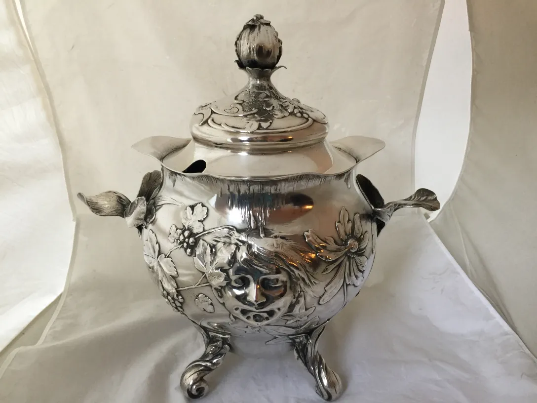 Antique WMF punch bowl decorated with flowers on a stand