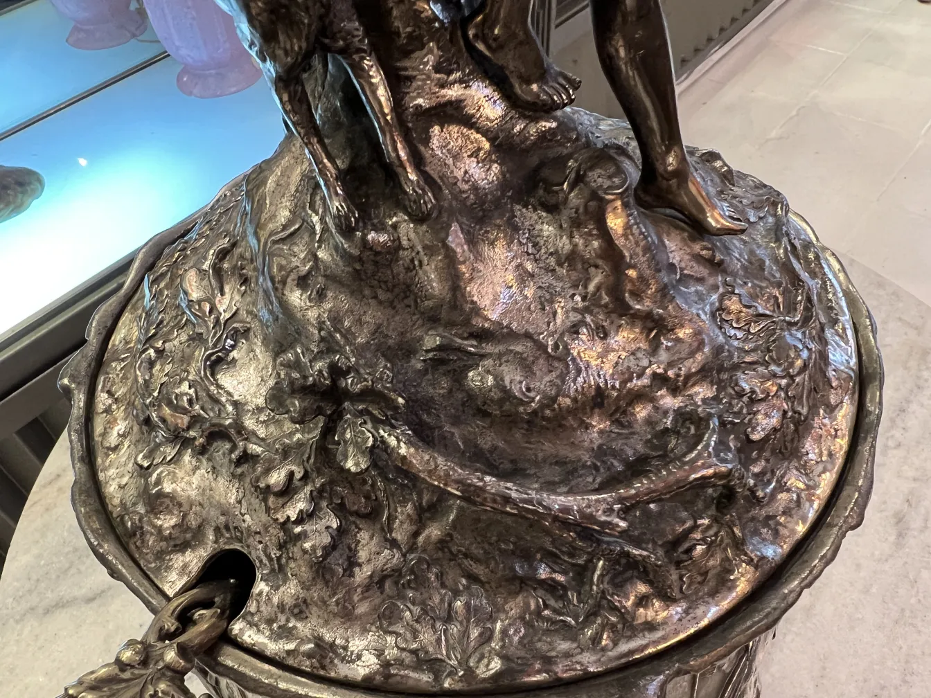 Antique WMF punch bowl with decorative details in an elegant setting.