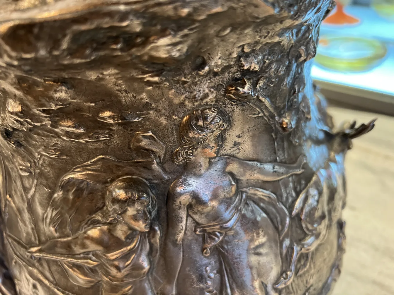 Antique WMF punch bowl featuring intricate relief details and an elegant design.