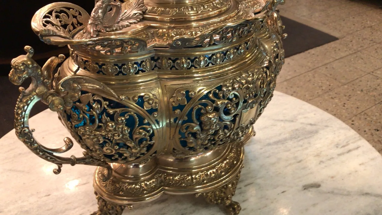 Antique WMF punch bowl with intricate and colorful decorative details.