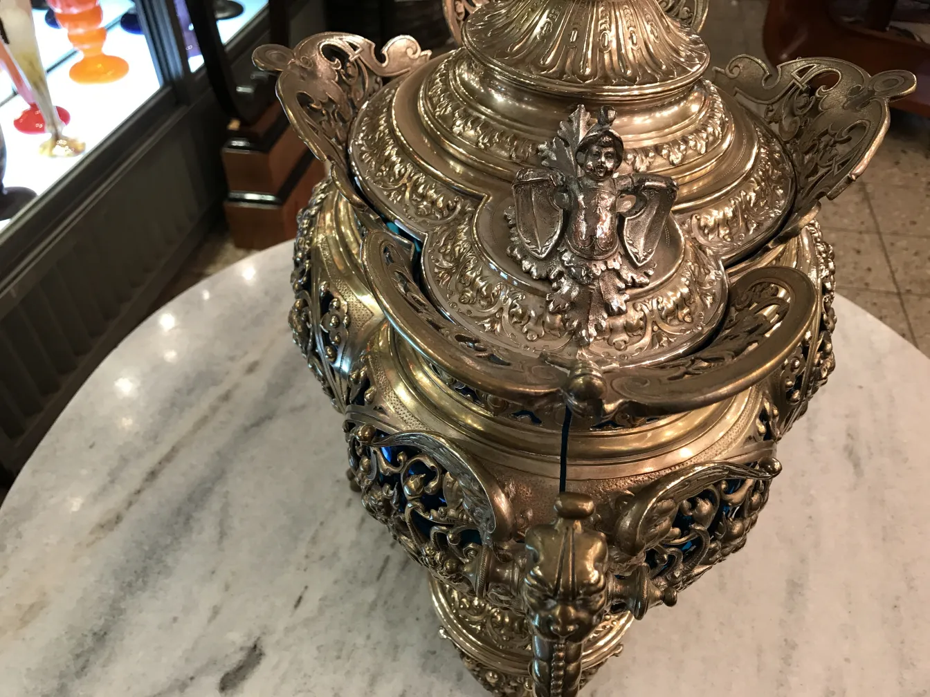 antique wmfs punch bowl with ornate details on marble