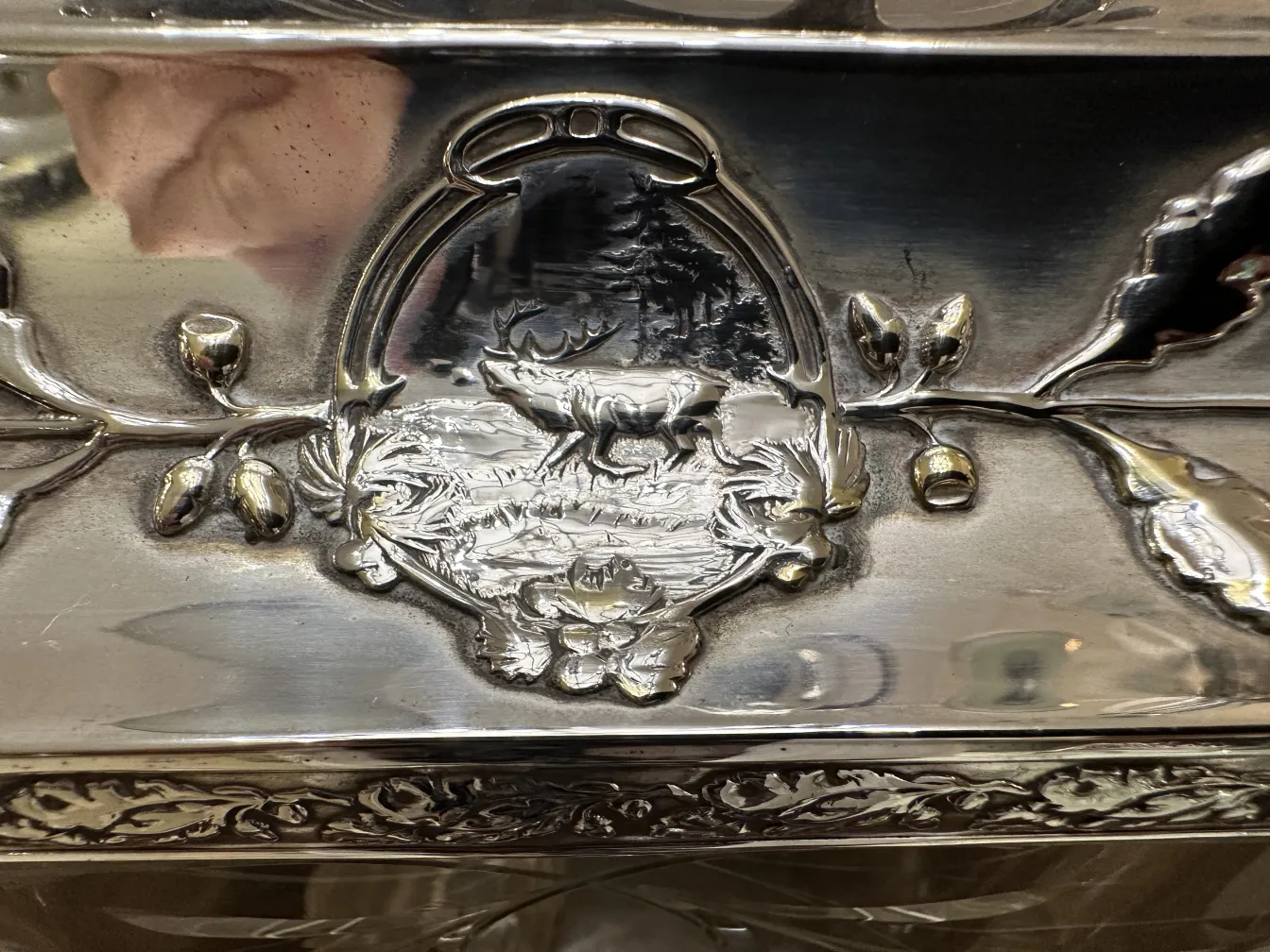 Antique WMF punch bowl featuring relief design and decorative details
