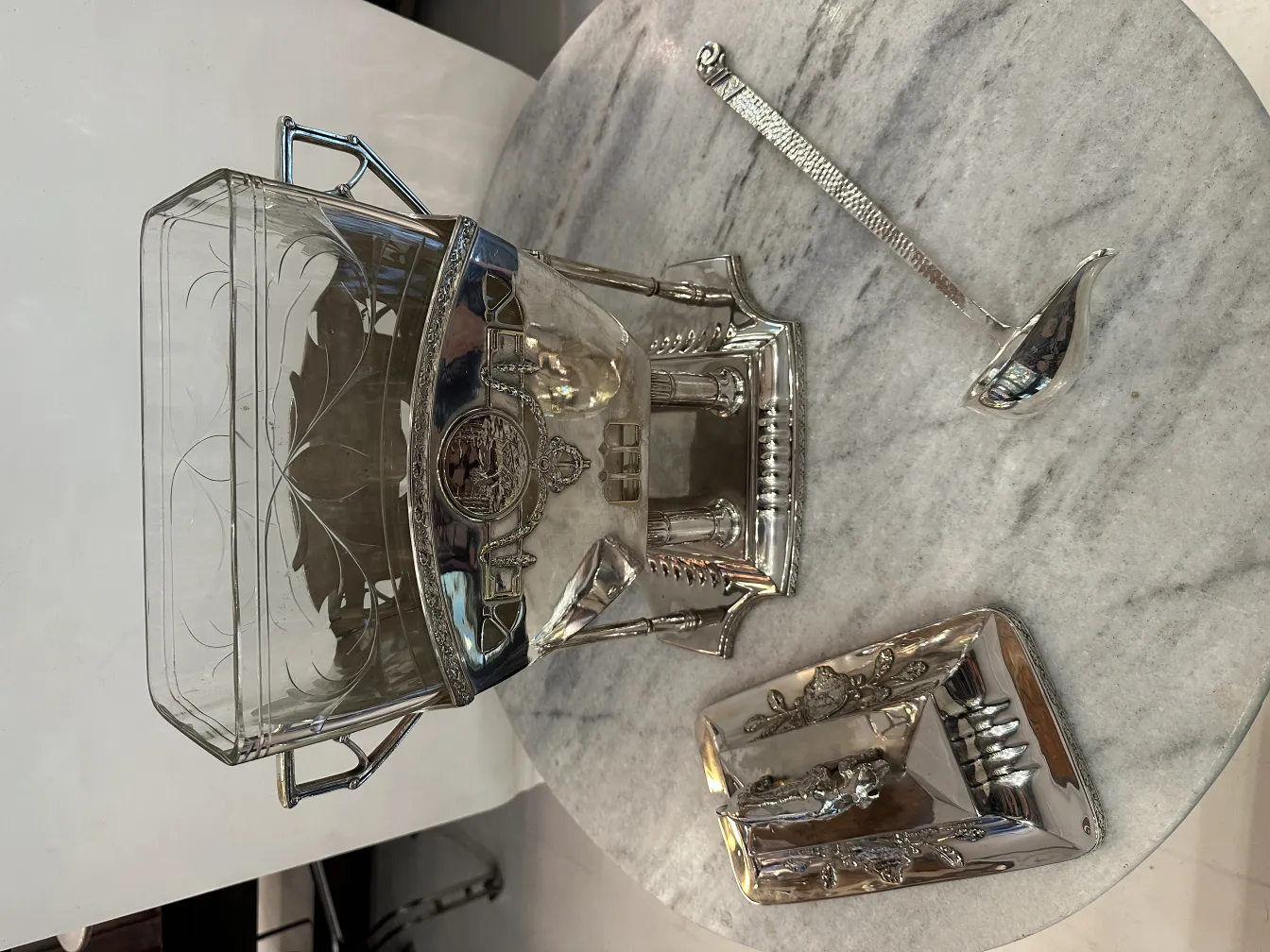 Antique WMF punch bowl with ladle in a stylish setting.