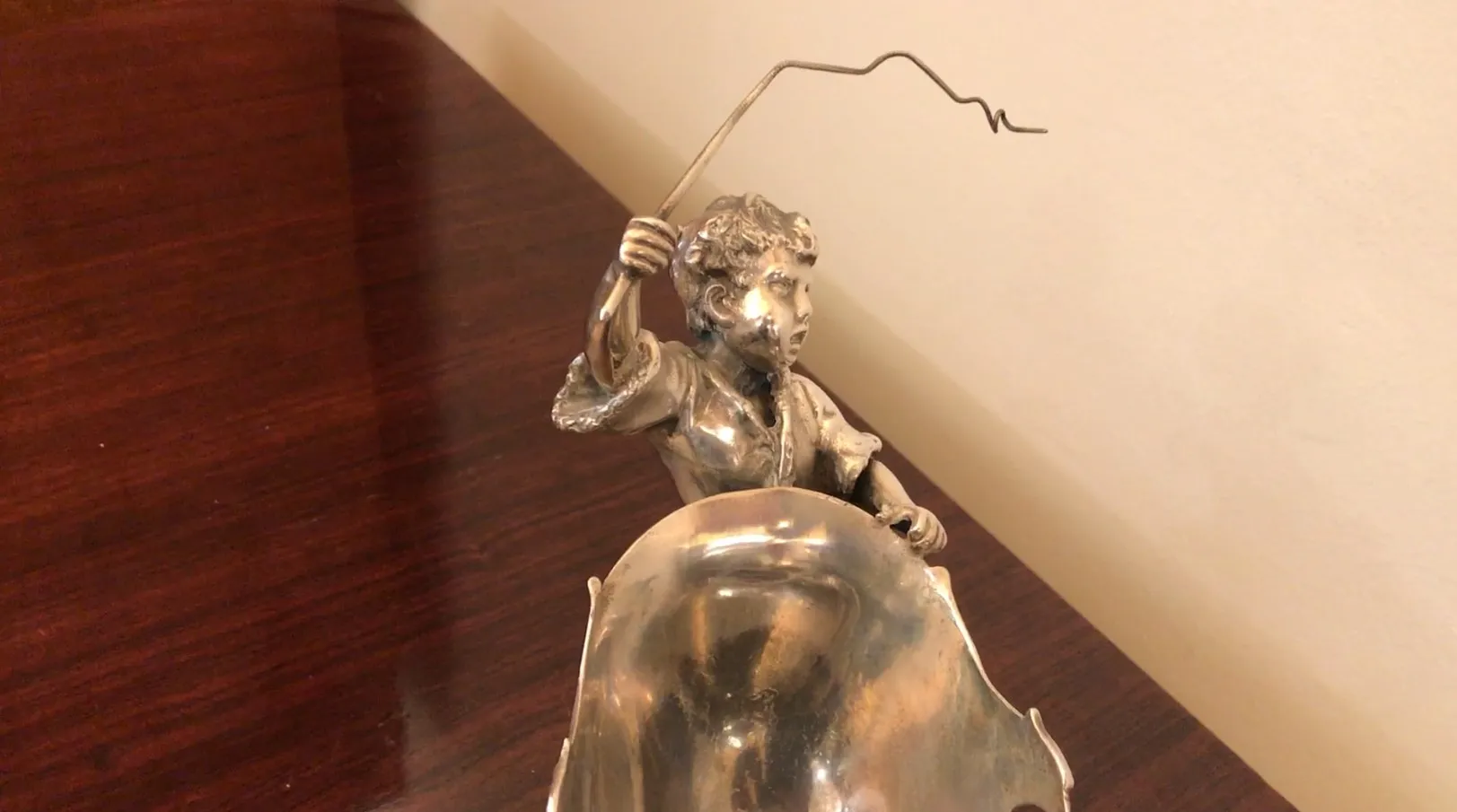 Antique card tray WMF featuring a decorative figure.