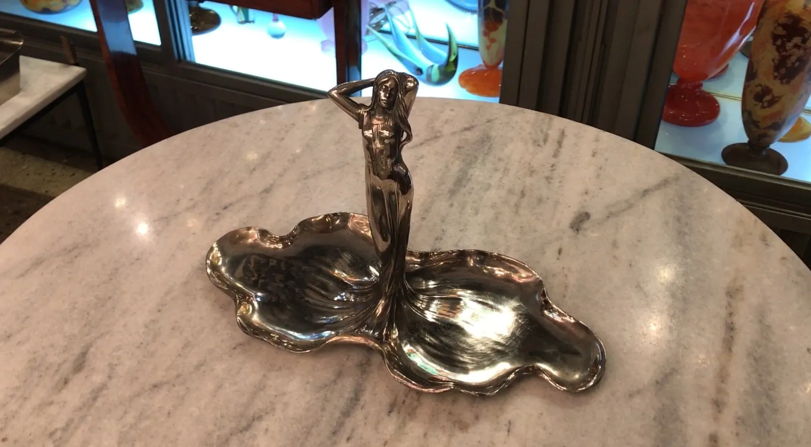 Antique card tray WMF featuring a decorative figure.