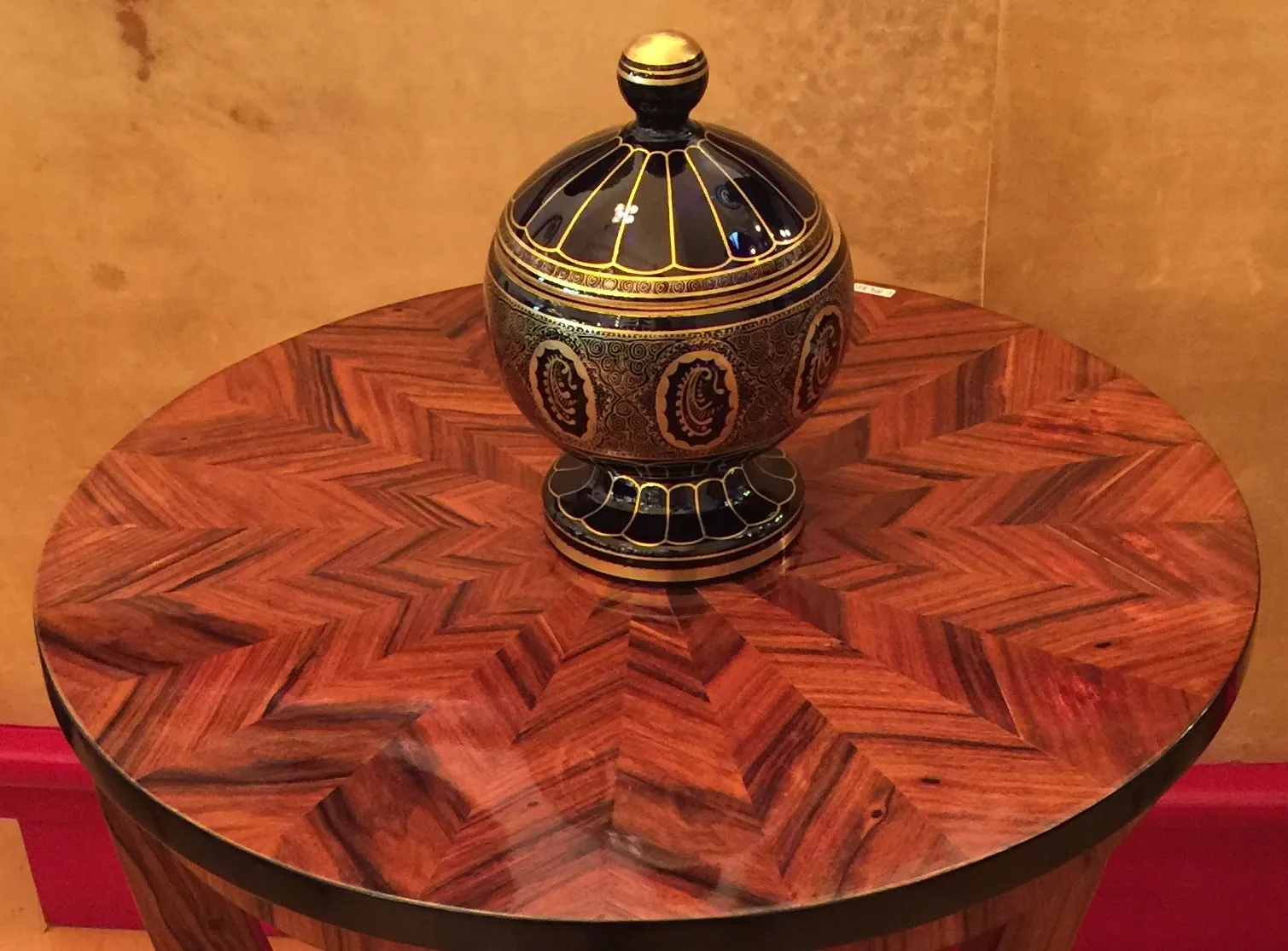 antique candy box with decorative blue and gold design