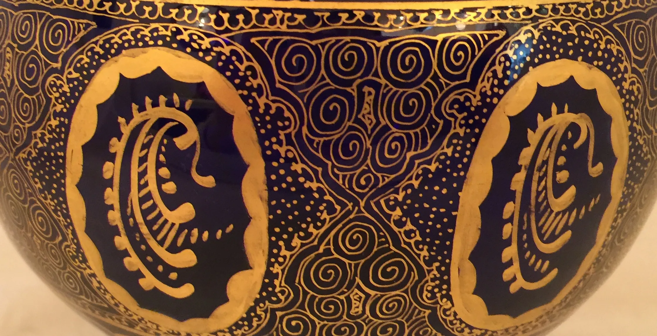 antique candy box adorned in blue and gold