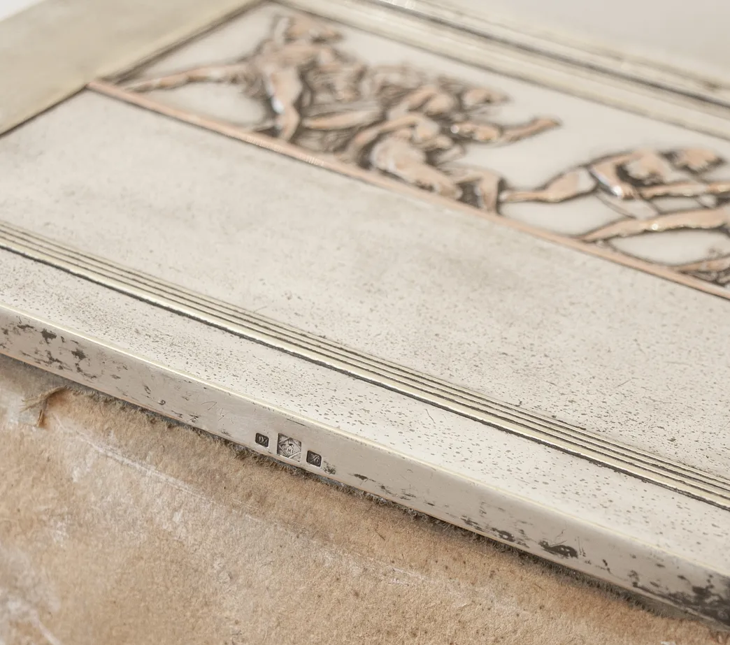 close-up view of antique 2 jewelers with artistic engravings