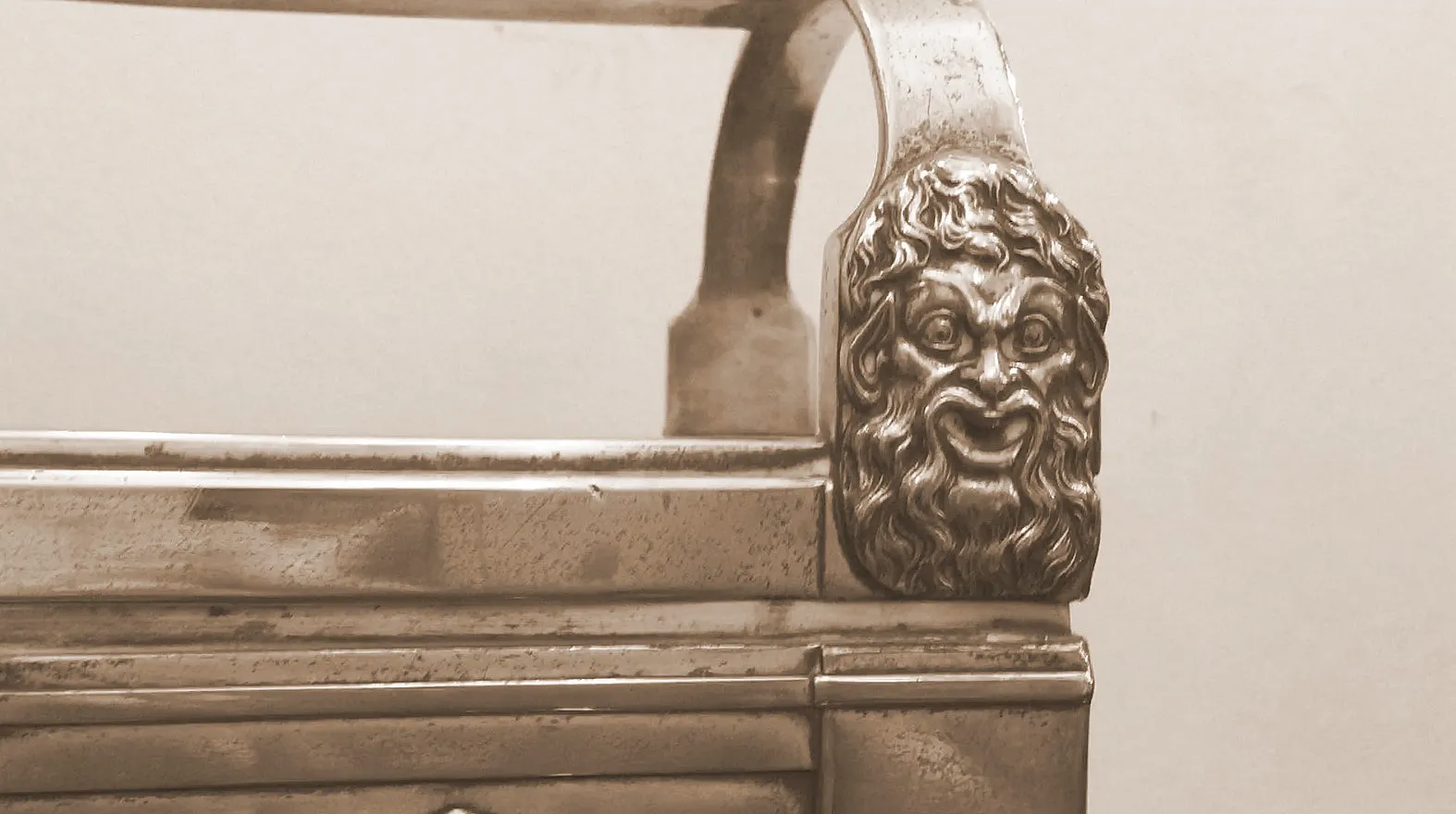 antique jewelers featuring decorative legs and a sculpted face