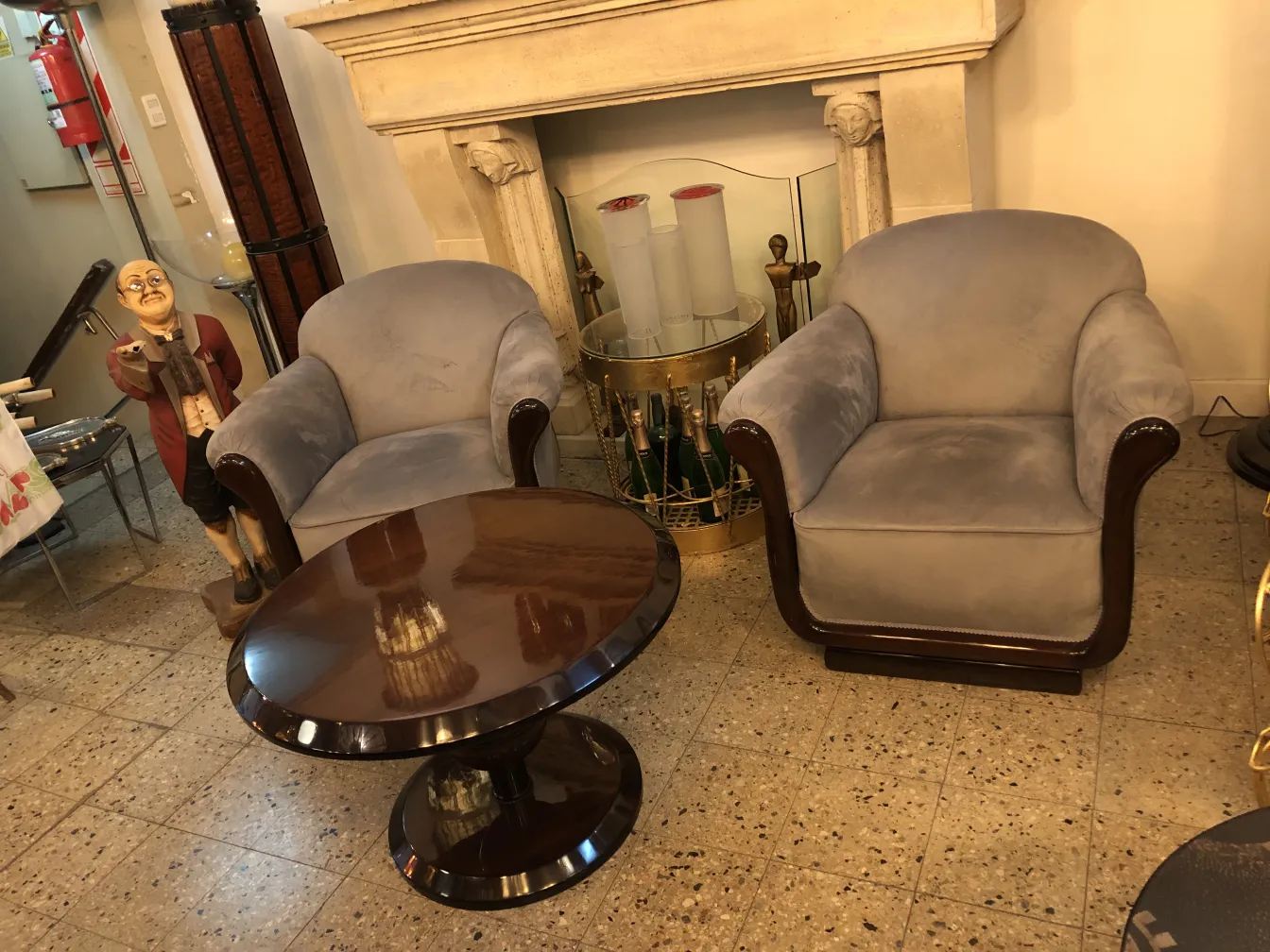 Two comfortable antique armchairs in a cozy setting.