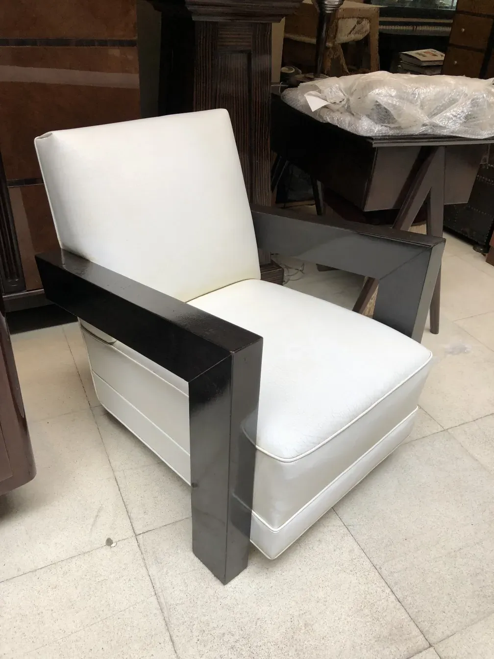 2 white armchairs in a stylish setting