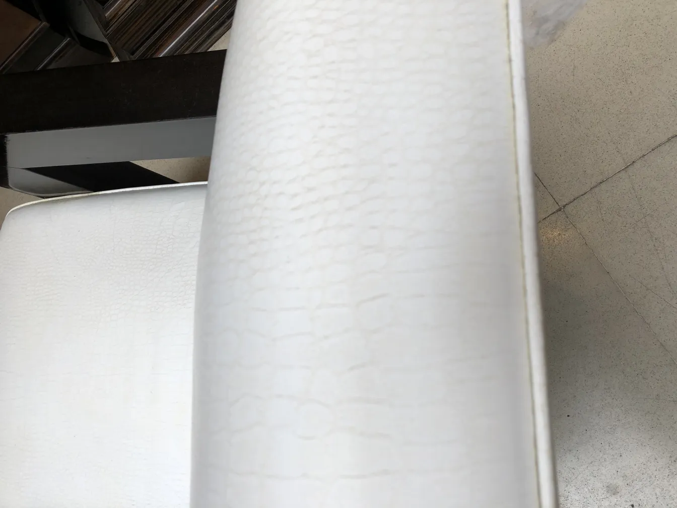 Side view of two antique white armchairs with gentle details