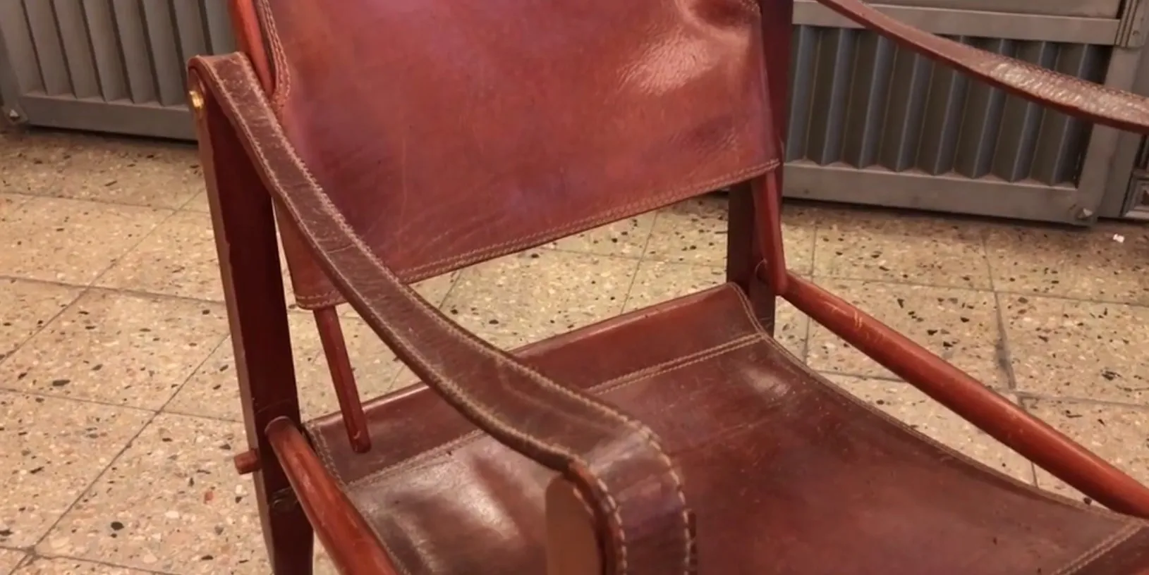 Two antique armchairs by Kaaren Klint in a neutral setting.
