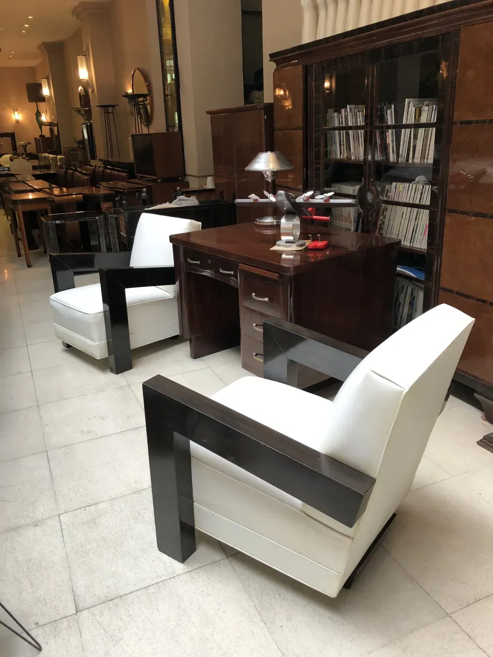 2 antique armchairs with elegant structure in a cozy setting