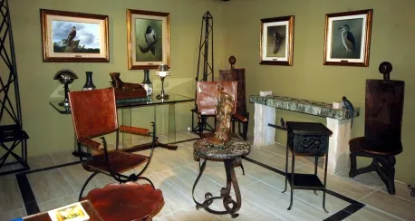 two antique armchairs in a classic decorated setting.