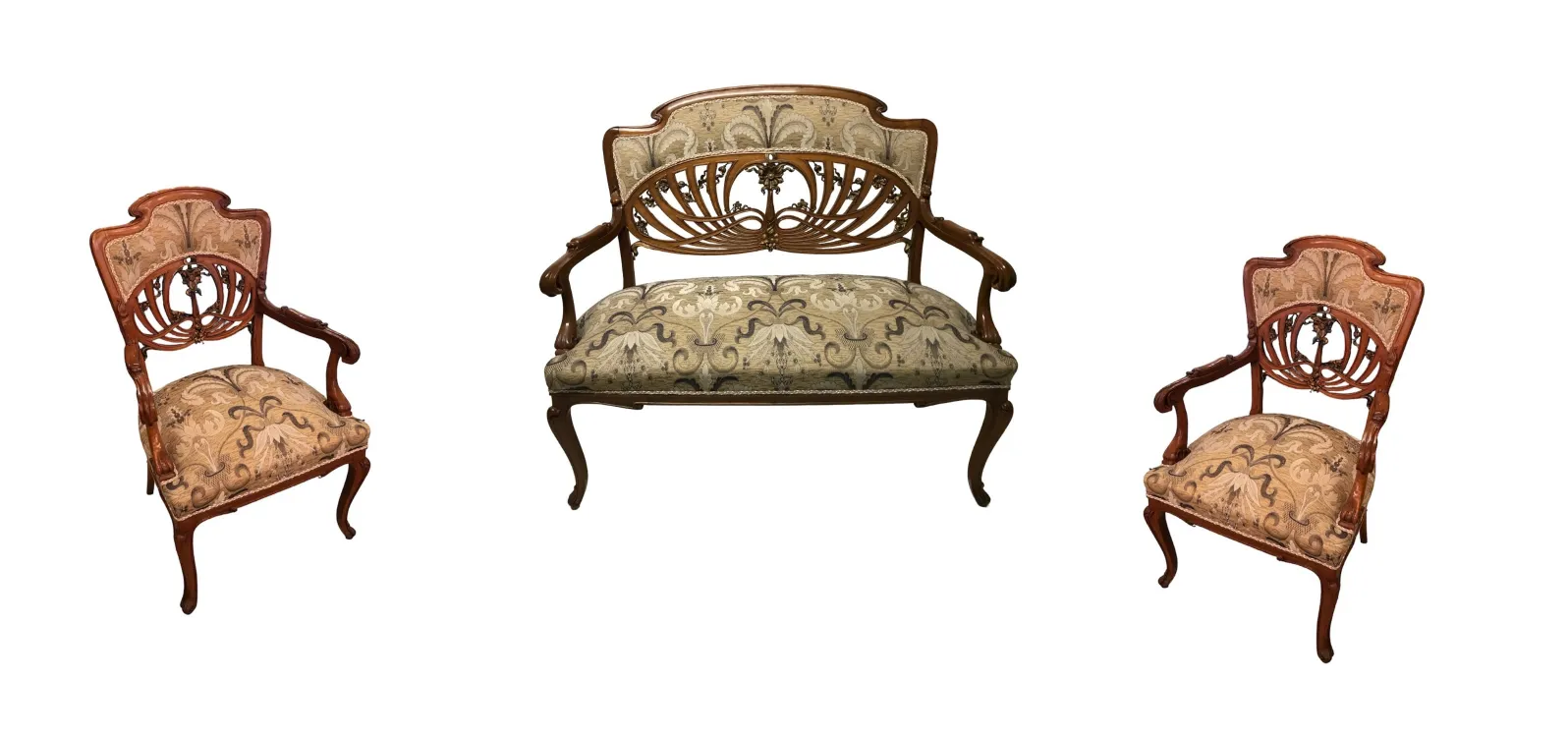 Three elegant antique art nouveau armchairs in a classic setting.