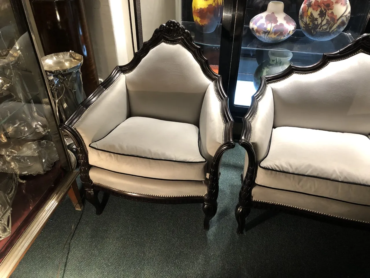 Three antique armchairs by Paul Follot in an elegant setting.