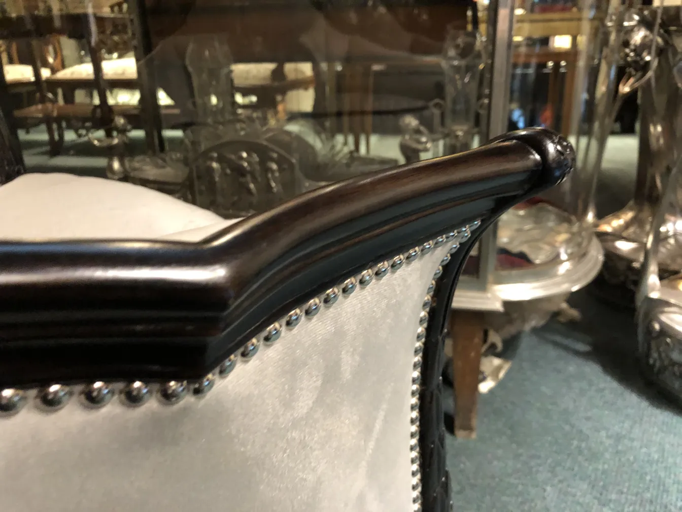 View of an antique armchair by Paul Follot with metal details.