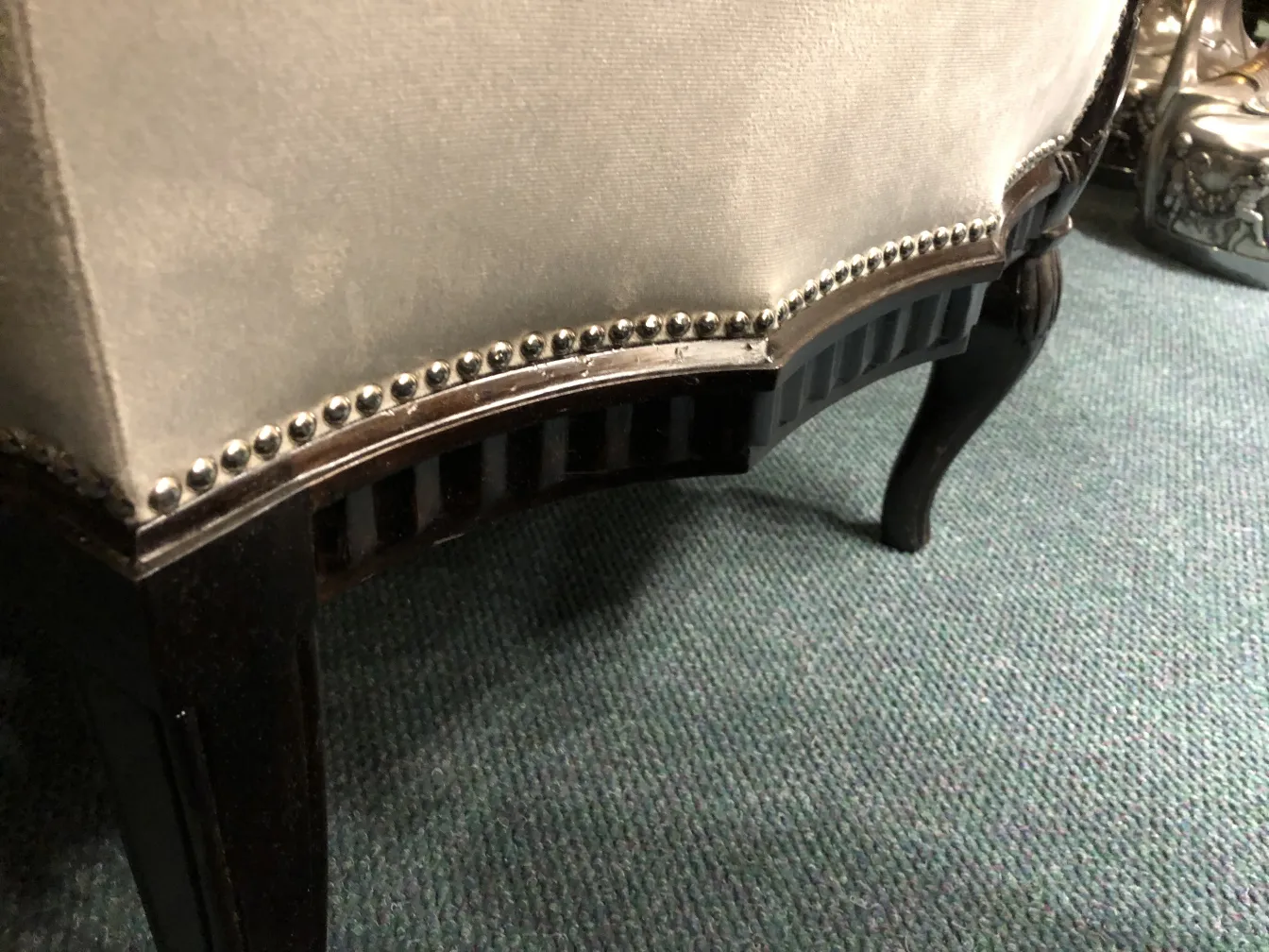 Three antique armchairs by Paul Follot in an elegant setting, featuring detailed base.