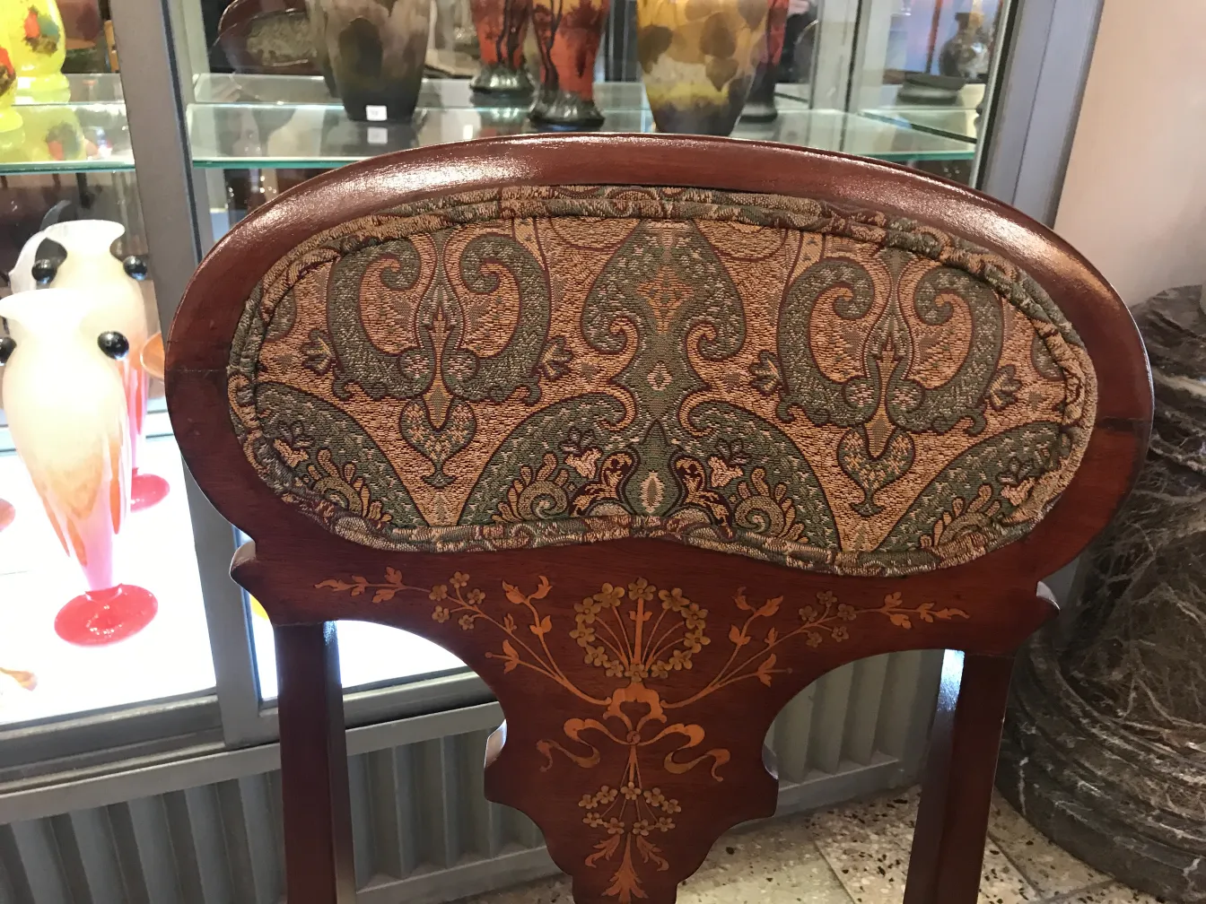 view of antique armchairs and chairs in decorative setting