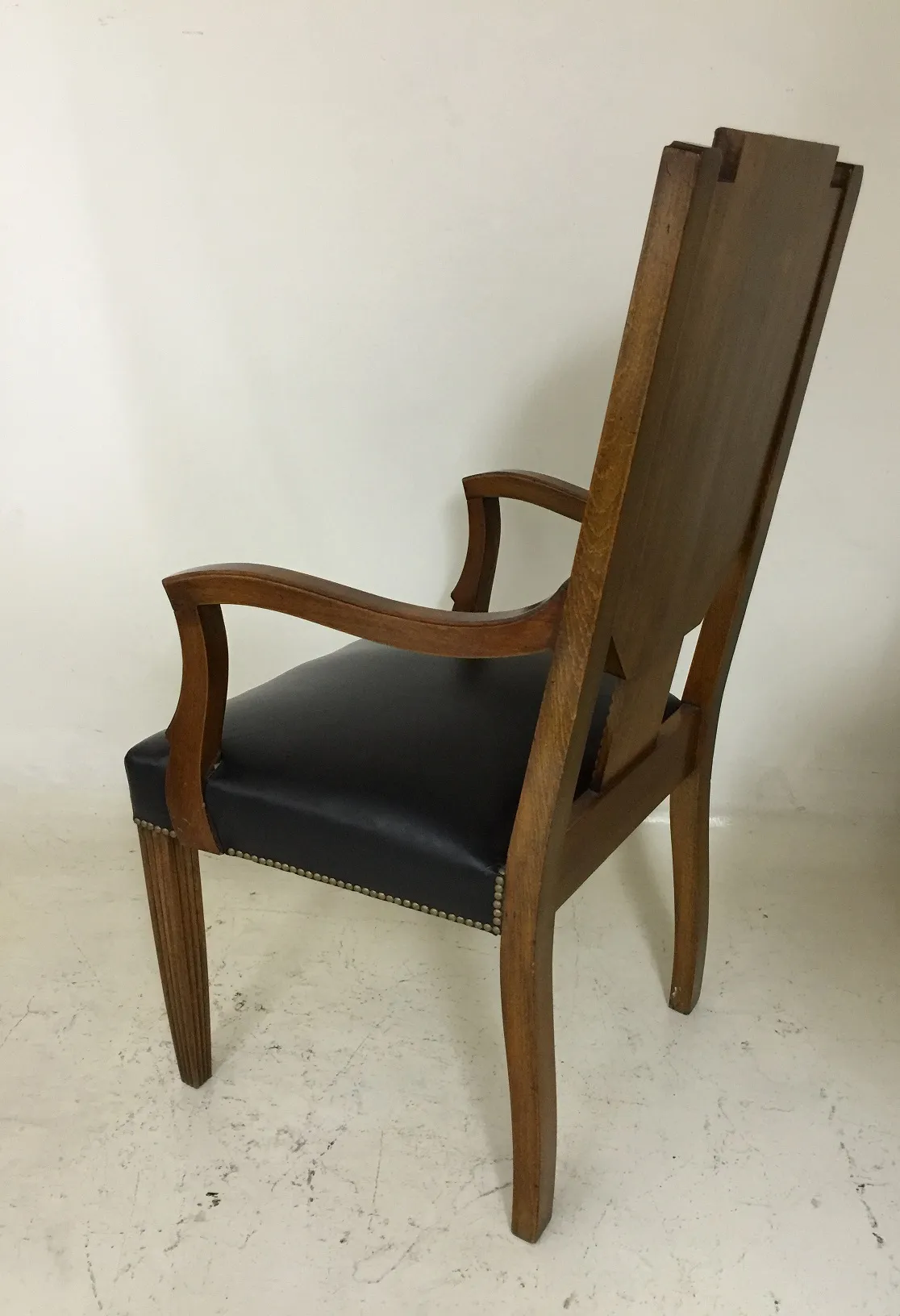 antique desk chair with arms and black upholstery