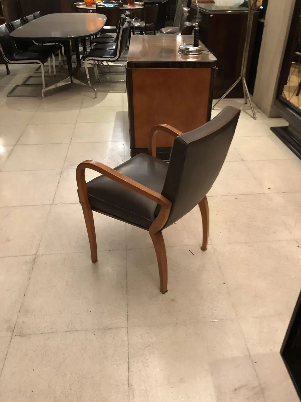Antique desk chair in a contemporary setting.