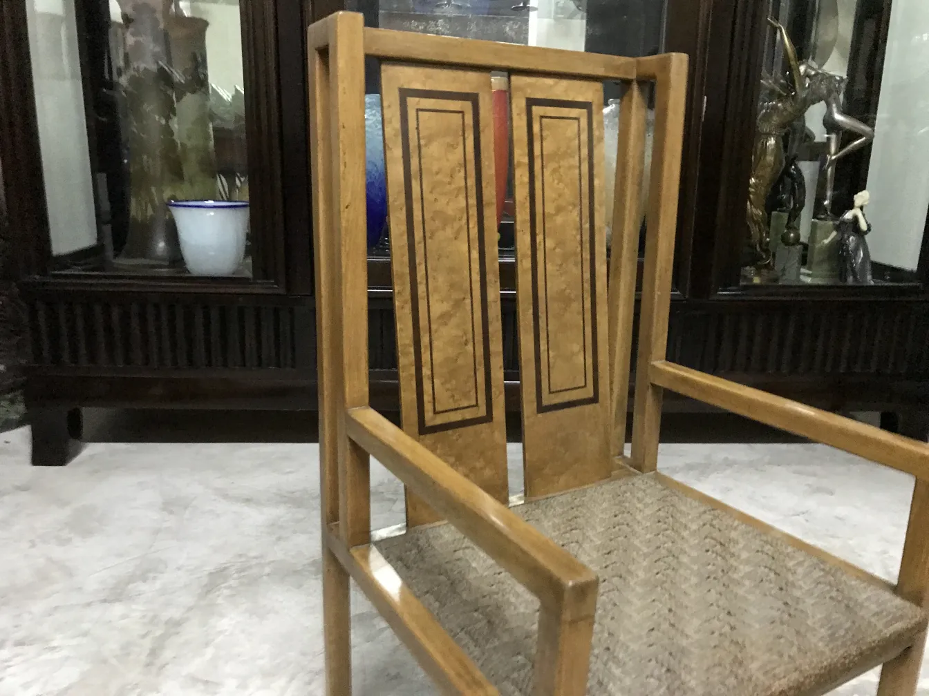 Antique desk chair with distinctive style by Wilhelm Schmidt, clear wood decorative details.