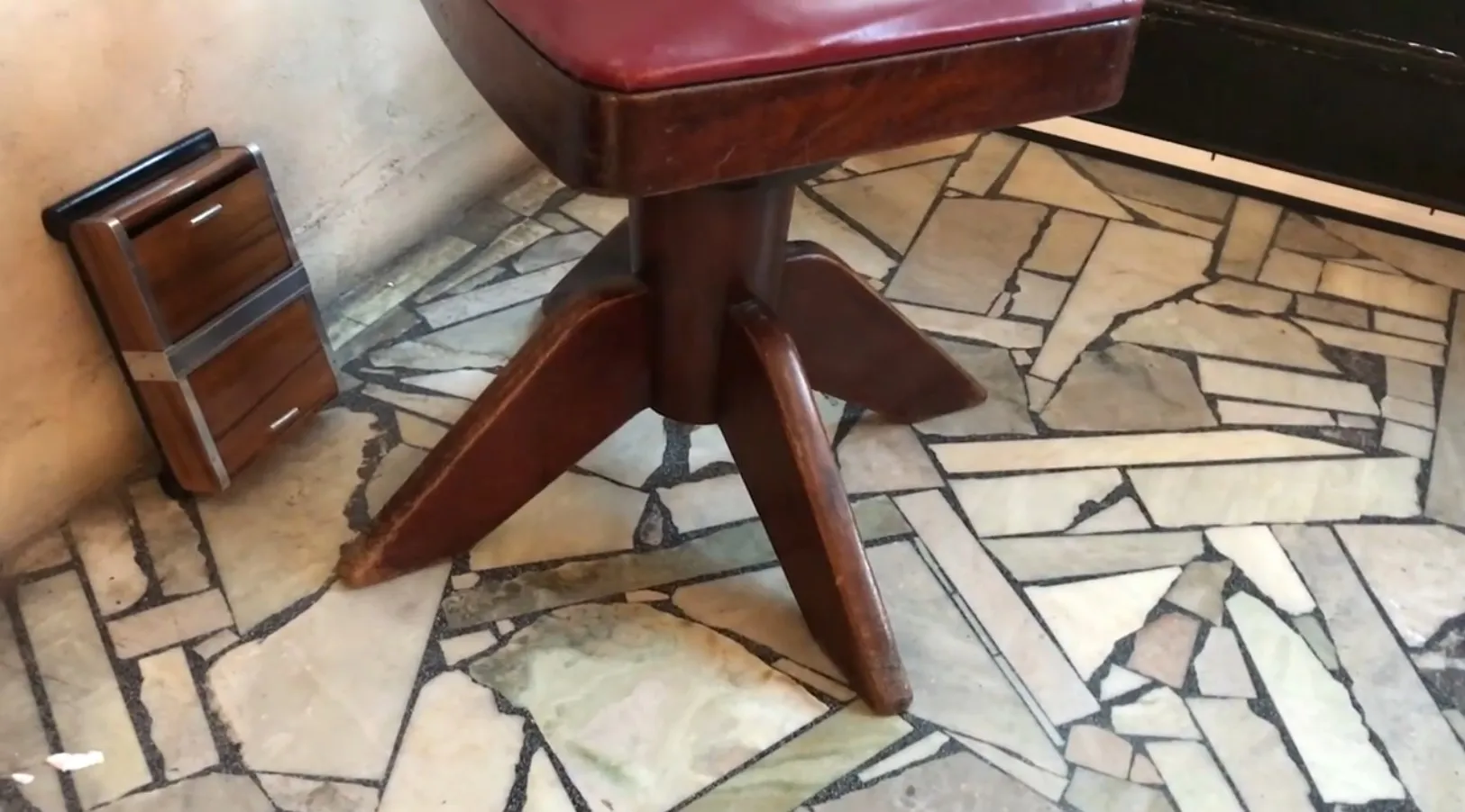 Four antique desk chairs in a classic environment