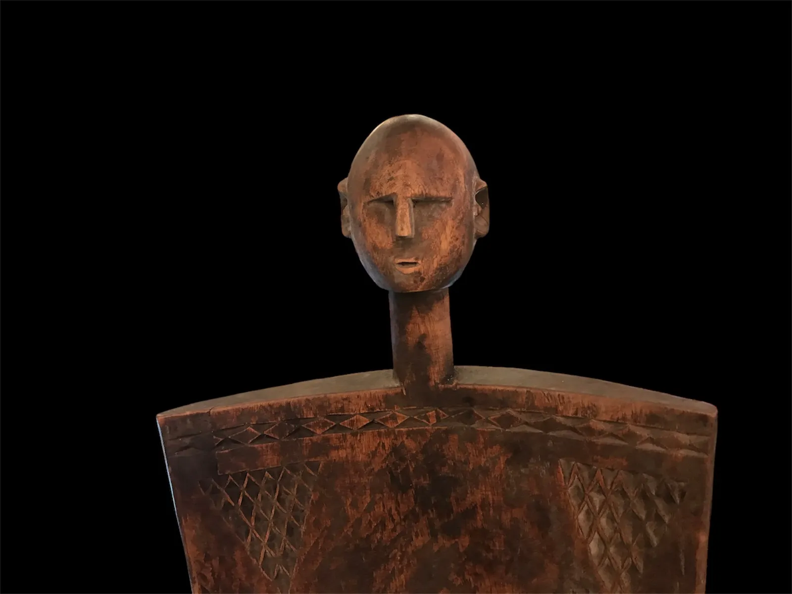 two antique chairs with figure, black background