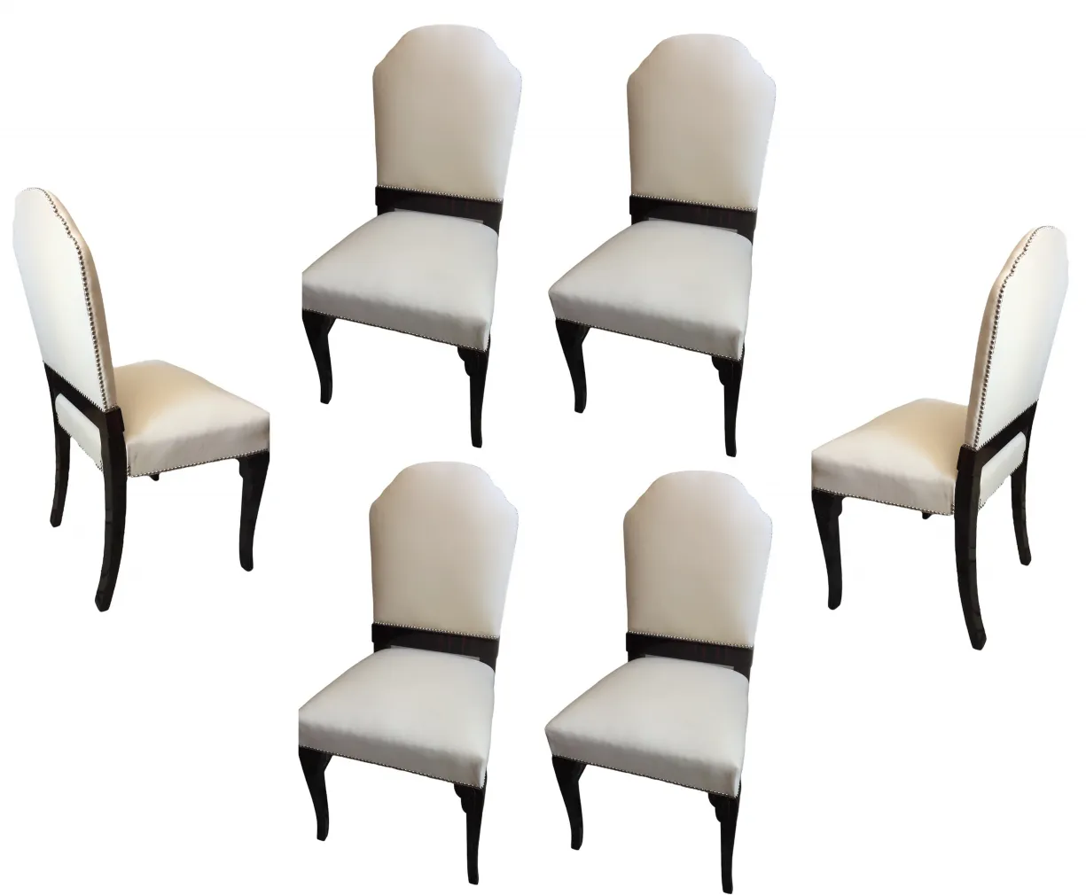 Six antique chairs in an elegant design, light color, with a cozy atmosphere